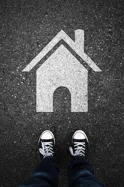 Photo of Home sign on asphalt background