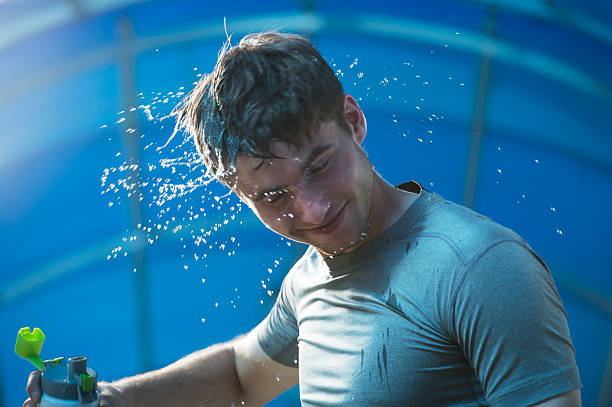 istock Young man having a refreshment of water 473216386