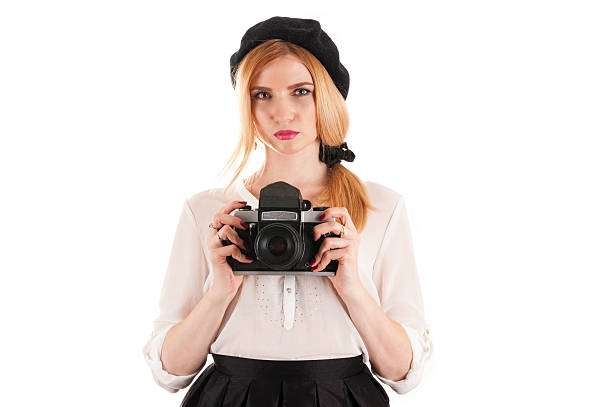 istock retro woman with retro camera 473219442