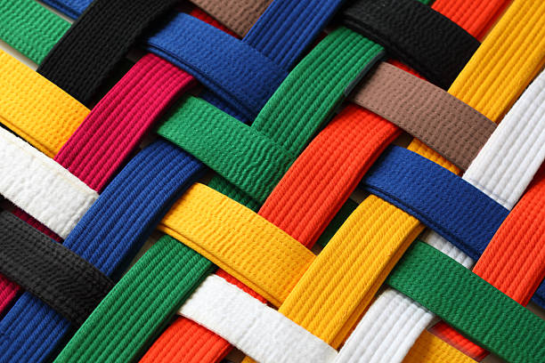 Interwoven colorful martial arts belts Colorful of martial arts belts rank system background judo photos stock pictures, royalty-free photos & images