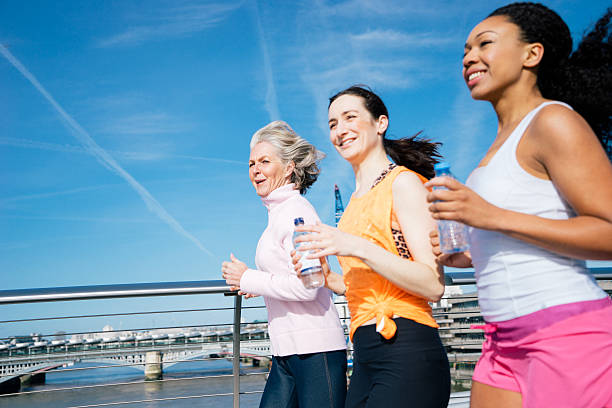 istock Smiling Women Jogging Together 473222812