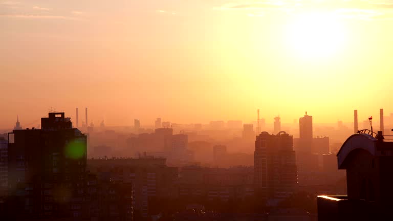 Sunrise over the city. Time lapse.