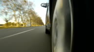 istock Driving a car on country road. Time-Lapse POV side 473226587