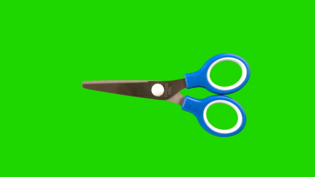 Scissors animated on a green screen background.