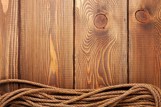 istock Wooden background with marine rope 473229794