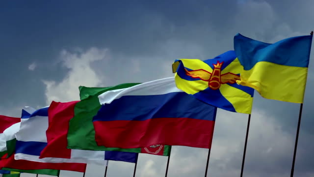 Many countries flags on flagpoles. Ukrainian, Russian, Turkmen. Union, politics