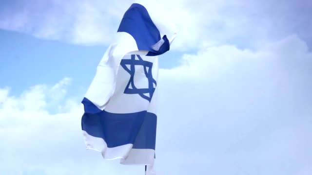 Israeli national flag waving on flagpole. Israel, Palestine