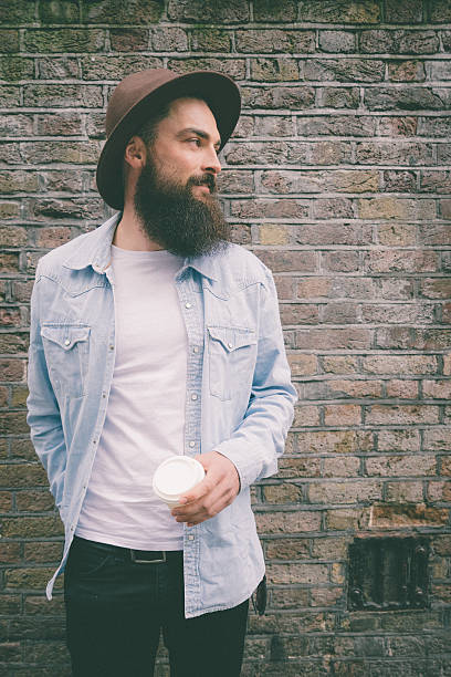 istock Portrait Of A Bearded Man On Brick Wall Background 473236134