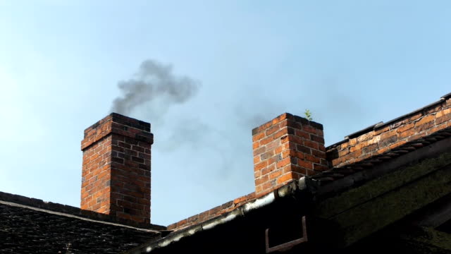 Smoking brick chimney.