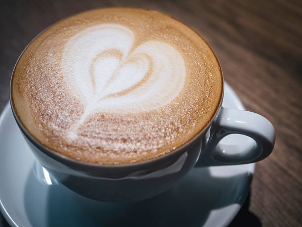 istock Cup of coffee with heart shape foam Close up 473236700