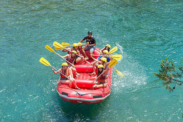 istock High angle view of people rafting on the river 473243264
