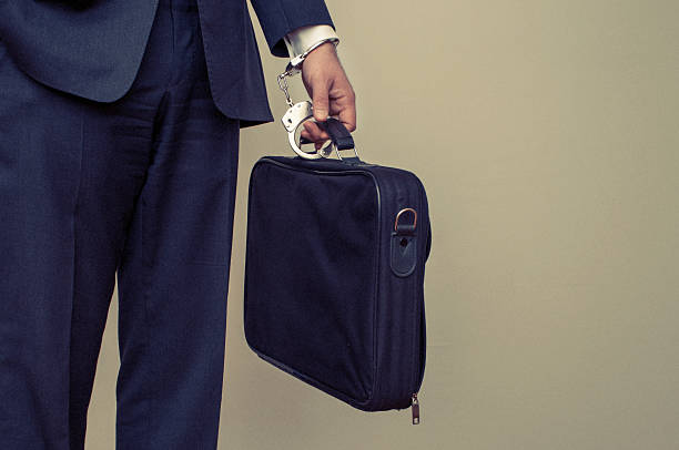 istock Businessman handcuffed to briefcase 473243518