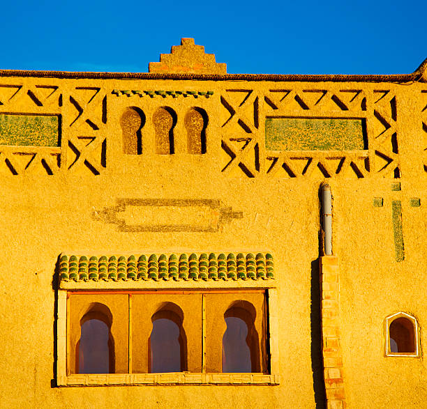 old brown construction in africa morocco and sky  near the tower
