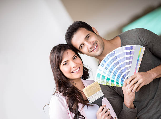 istock Couple painting their home 473246684