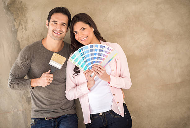 istock Couple painting their house 473246688
