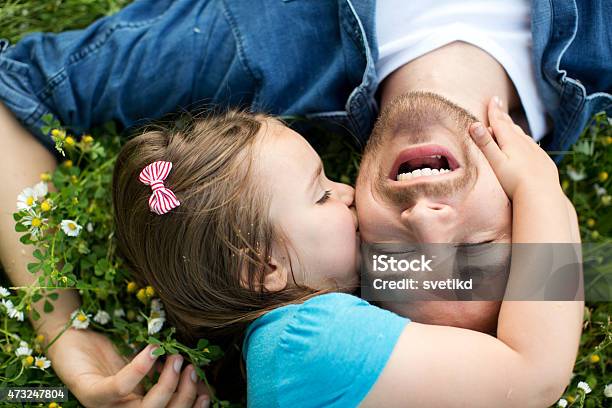 Father And Daughter Outdoors In A Meadow Stock Photo - Download Image Now - Father's Day, Father, Kissing