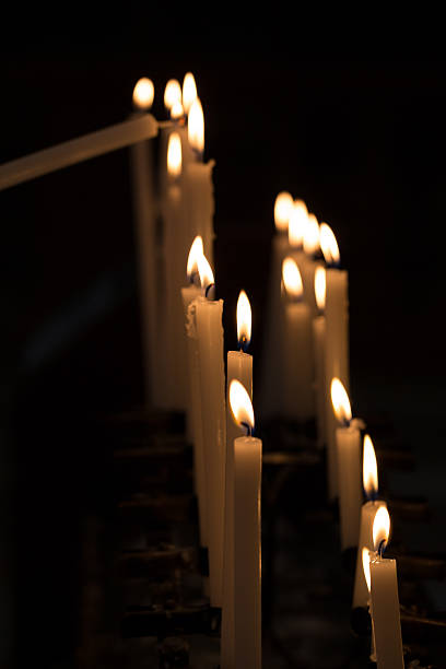 istock Candles in a Church, Black Background 473248610