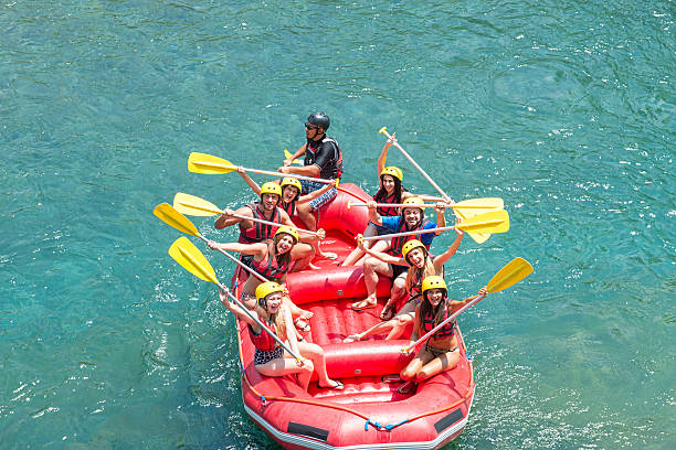 istock High angle view of people rafting on the river 473248618