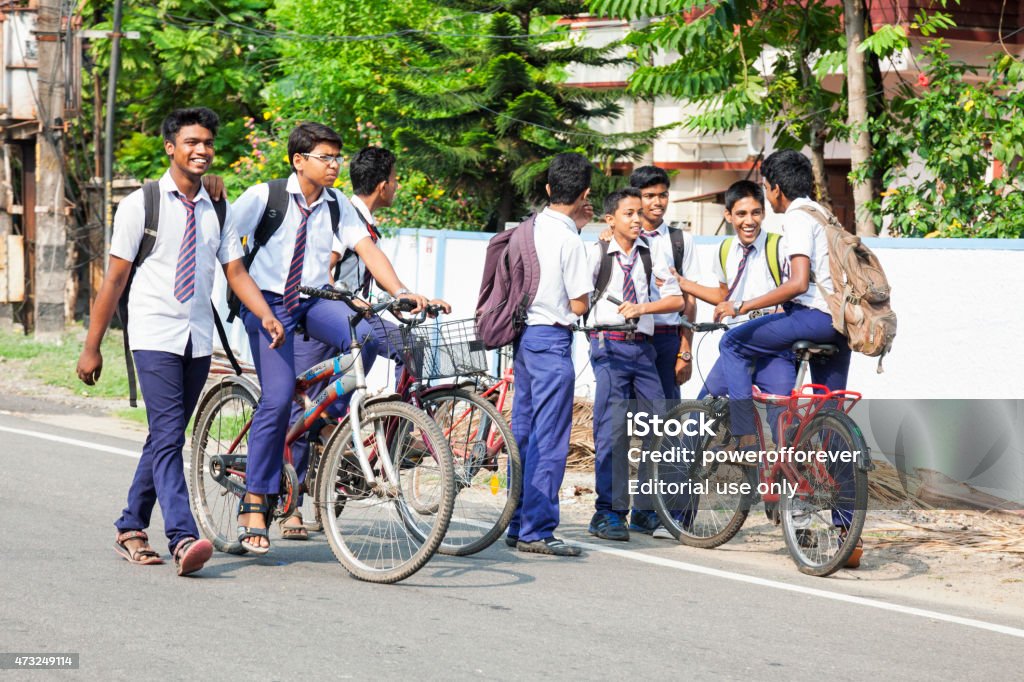 Group of Schoolboys in Kochi, Kerala, India Kochi, Kerala, India - March 19, 2015. A group of boys chatting after school in Kochi, India. School Children Stock Photo