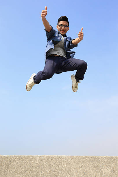 istock Happy man run and jump 473252344