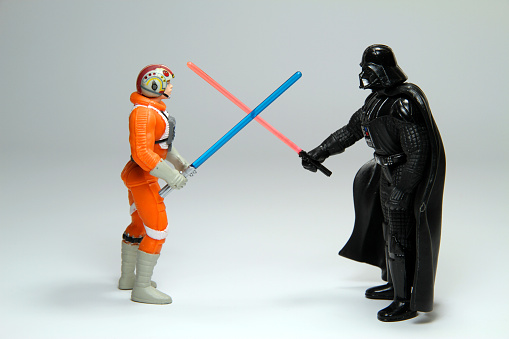 Vancouver, Canada - March 18, 2012: Luke Skywalker and Darth Vader from the Star Wars film franchise, posed on a white background. The toys are created by Hasbro.