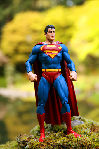 Vancouver, Canada - April 11, 2015: An action figure model of Superman, sculpted by Paul Harding and released by DC comics, against a Natural background.