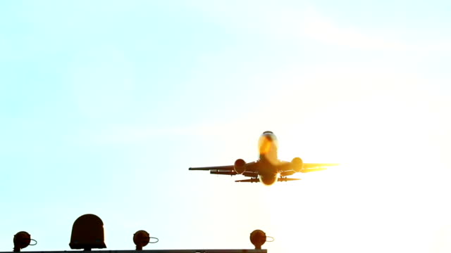 Aircraft directly above camera daytime through sun rays