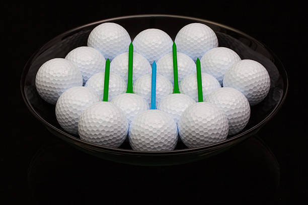istock Black ceramic bowl full of golf balls 473259772