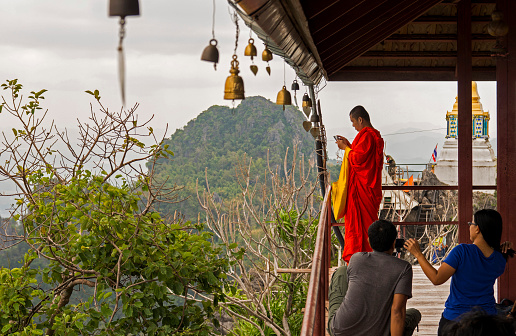 Nan, Thailand - December 17, 2014: Buddhist monk at the Wat Chalermprakiat Prajongklao Rachanusorn mountain top temple in Nan Province.