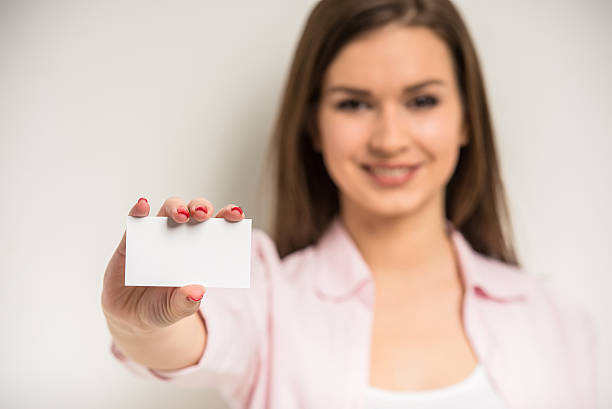 istock Girl with a business card 473260288