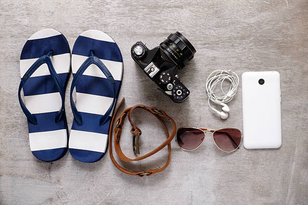 istock summer beach accessories slipper camera strap sunglasses mobile phone earphones 473260602