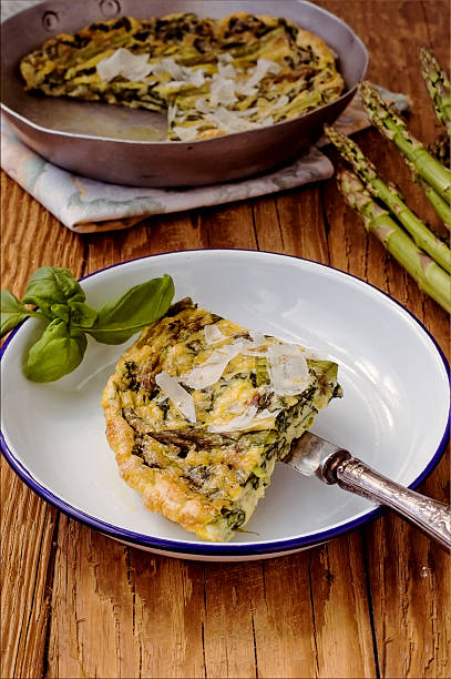 Spinach e green asparagus frittata. Italian cuisine stock photo