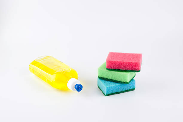 istock Dishwashing liquid with a sponge on white background 473263460