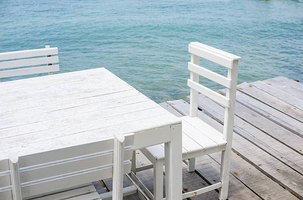 istock Wood dock White chair and table 473264664