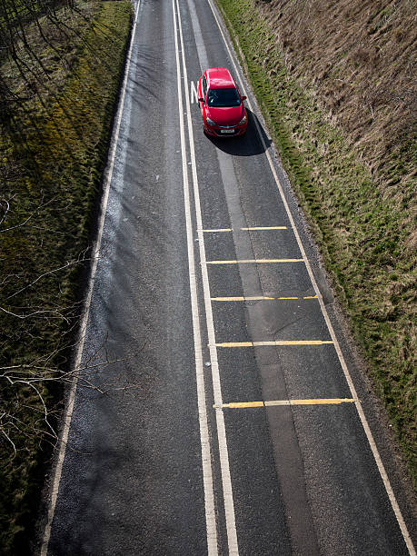 istock road white lines with car, Derbyshire, Britain 473265496