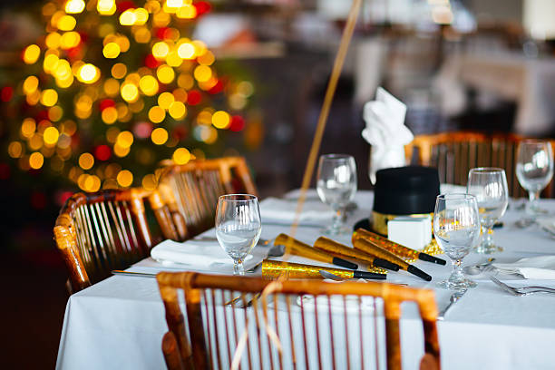 istock Fully set dining room table in front of a Christmas tree 473265686