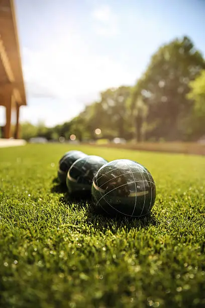 Bocce Balls in green grass on a sunny day, speaks to summer, fun, family and vacations.
