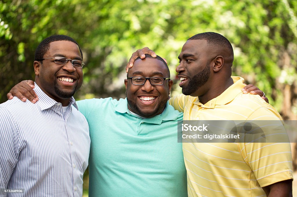 Brothers Brothers handing out laughing and talking. Group Of Objects Stock Photo