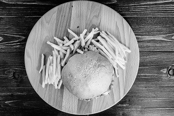 grilled hamburger on wooden board