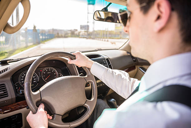 istock Businessman driving car 473270896