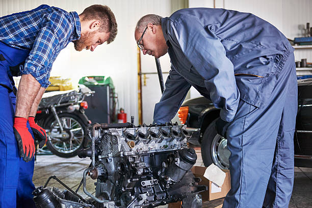 istock Trying to repair car's engine 473271154