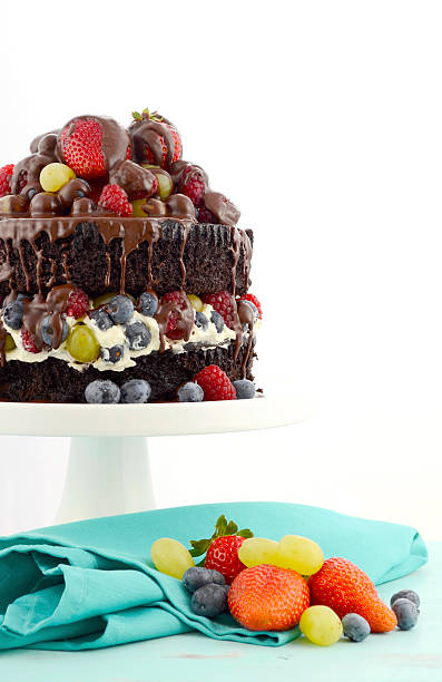 istock Deliciously divine chocolate cake with berries and cream. 473283852