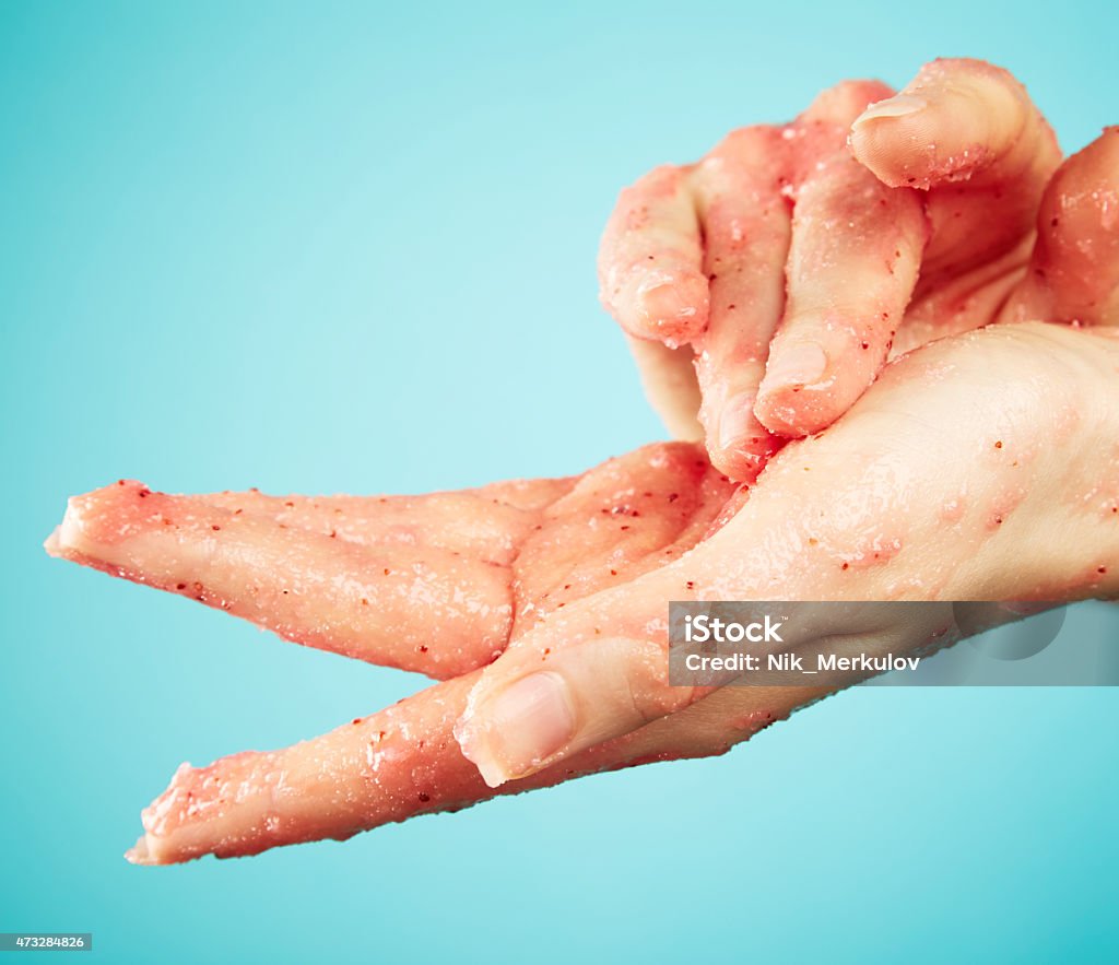 Female hands in body scrub Female hands in body scrub on blue background Exfoliation Stock Photo