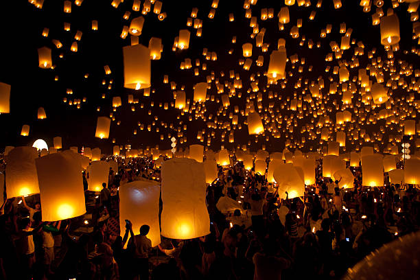 istock launching sky lanterns in Loy Krathong and Yi Peng Festival 473285706
