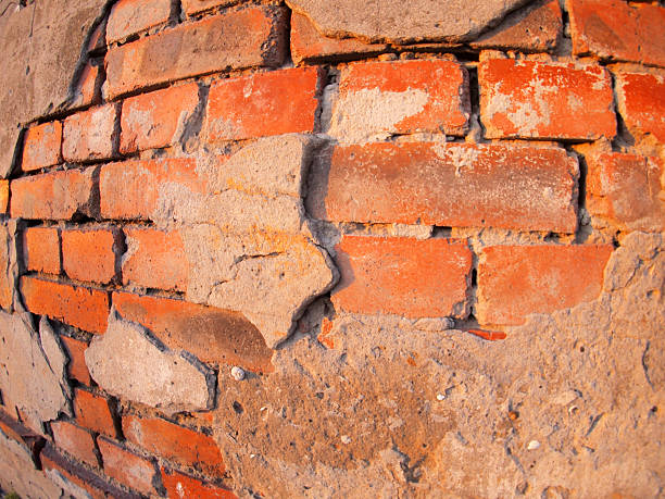 istock Fragment of an old shabby brick wall 473287526