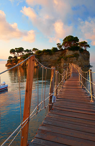 The first light of day falls on the small island of Agios Sostis, on the eastern side of the Greek island of Zakynthos.