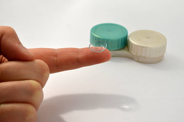 istock Ophthalmic lens in hand 473288670