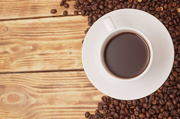 istock Coffee cup and saucer on a wooden table. 473289894