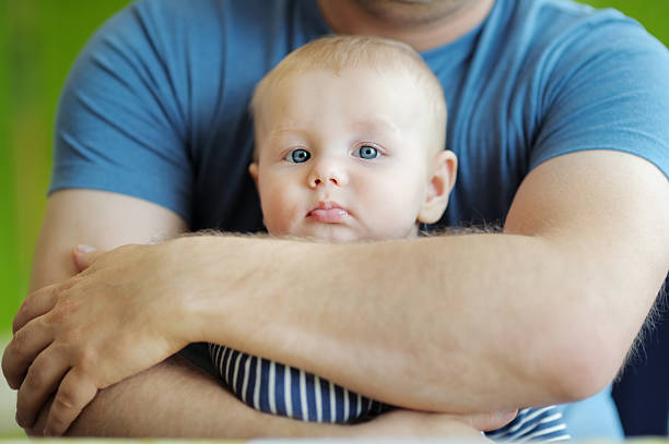 Man holding his little baby boy