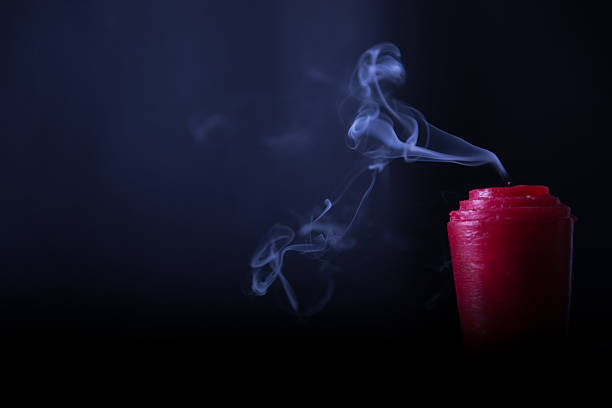 istock Enticing Silky Red Candle Smoke in the Dark 473290942